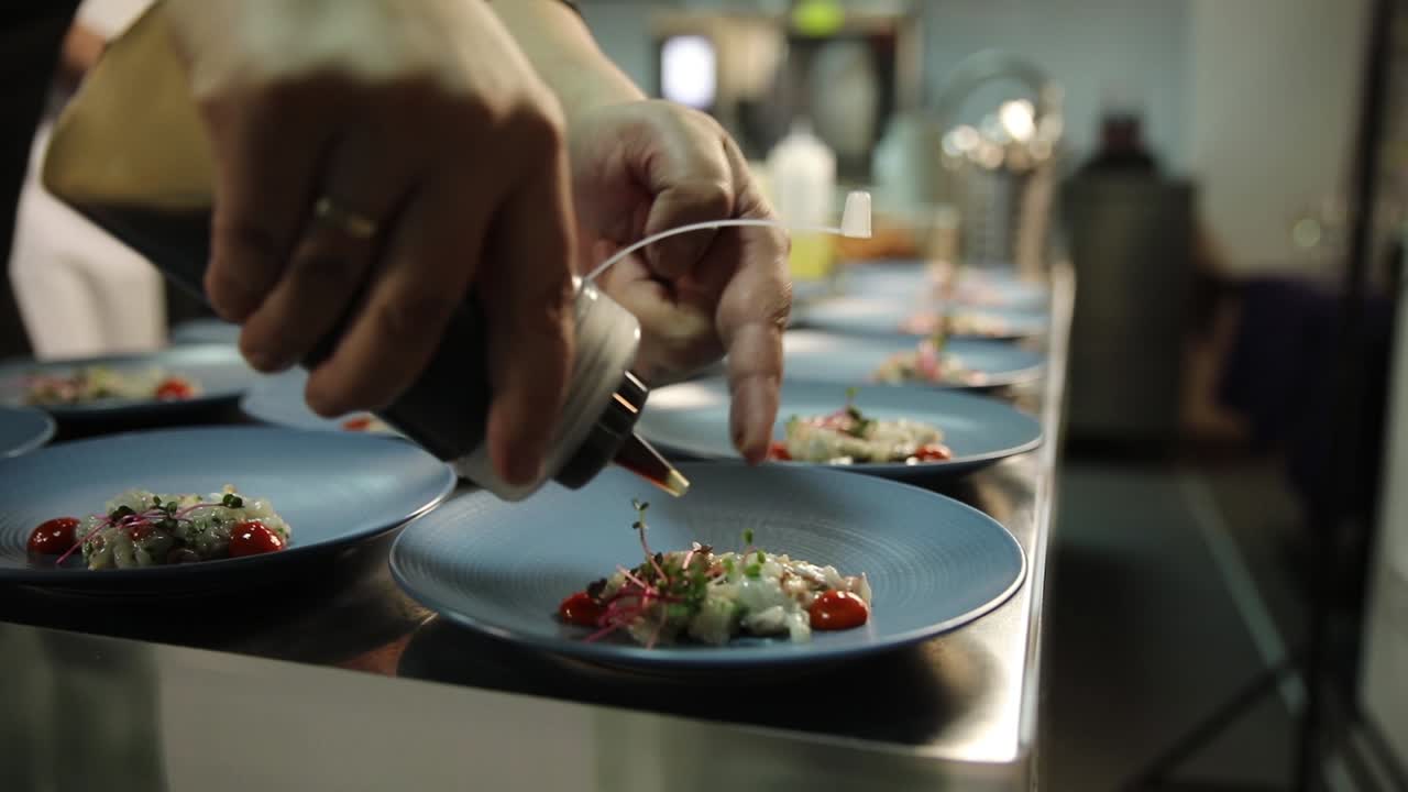 Chef preparing and serving a seafood dish