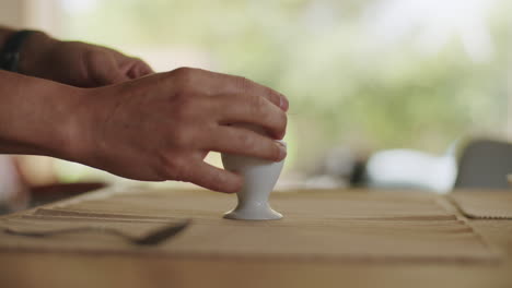 static medium shot of opening an egg with a knife