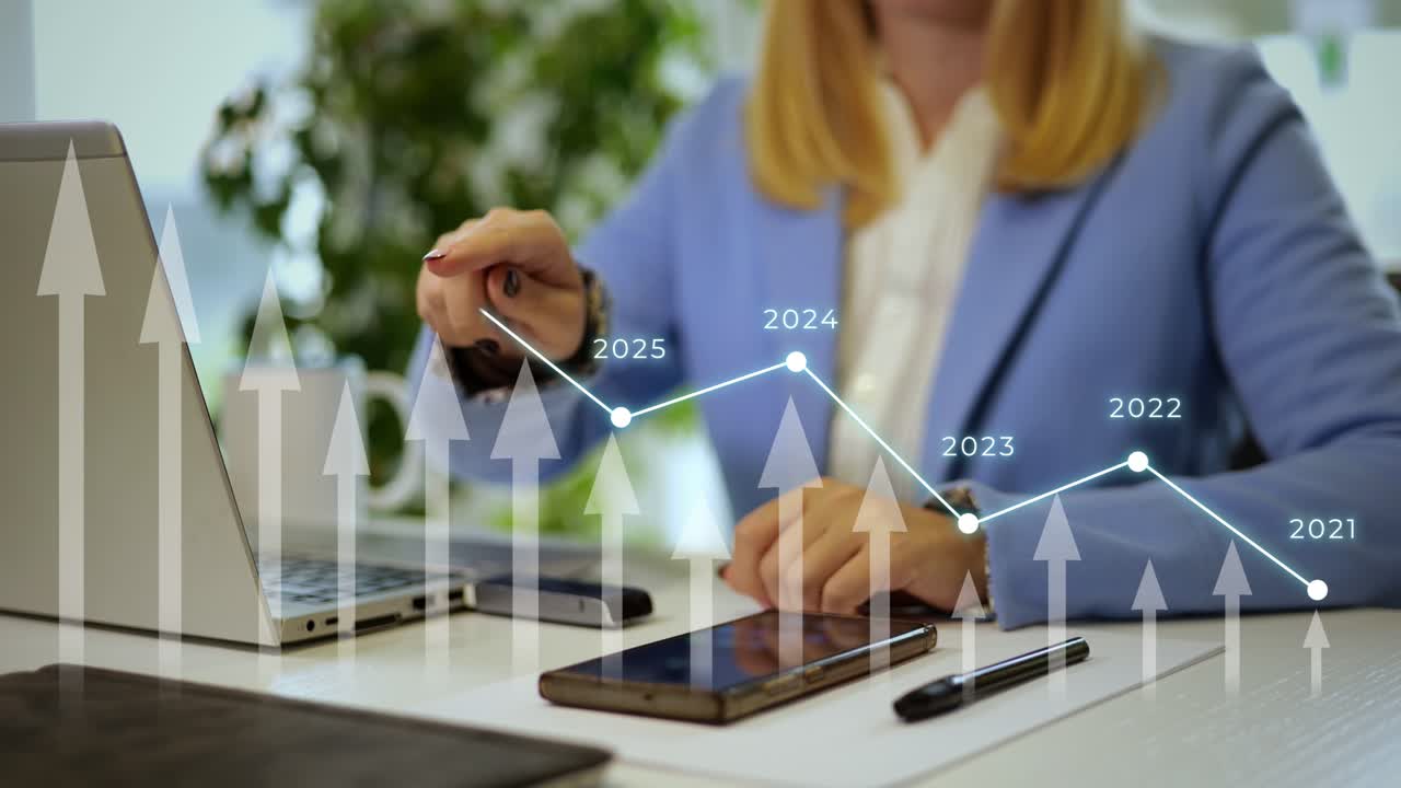 Double exposure with a business woman working on a laptop and a increasing chart