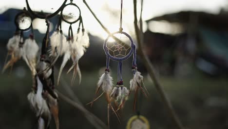 dreamcatchers hanging at sunset or sunrise