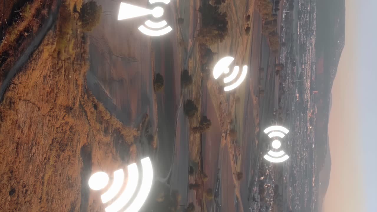 paisaje aéreo vertical que se acerca a una gran ciudad a distancia con el logotipo de animación de la antena wifi