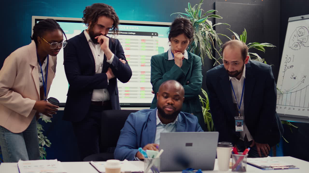 Corporate employees analyzing project updates to ensure goal accomplishment