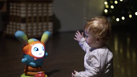 baby girl playing with her new toy in the living room 4k