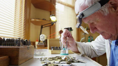 horologist repairing a watch