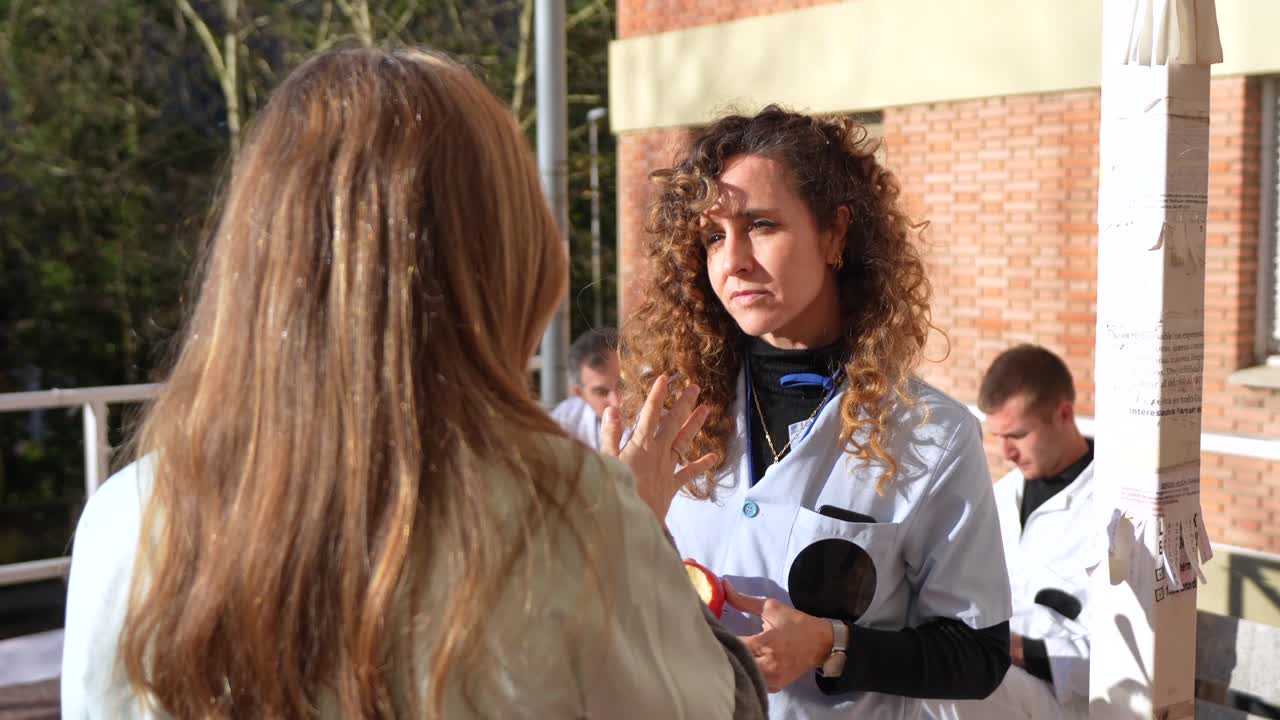 Medical professionals talking outdoors