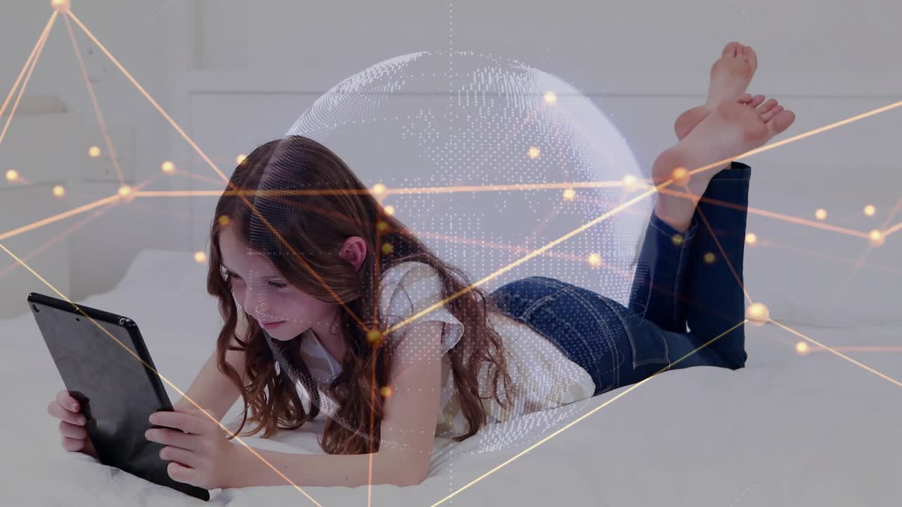 Girl lying on bed tapping tablet, causing globe, nodes and code overlay, smiling while learning
