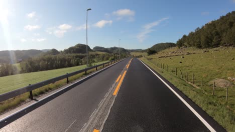 vehicle point-of-view driving a car on a road in norway