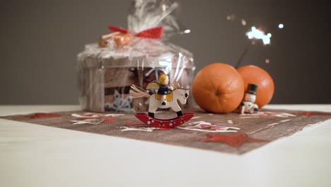 Slow-motion-little-see-saw-horse-with-Christmas-mood-and-lighting-sparkler