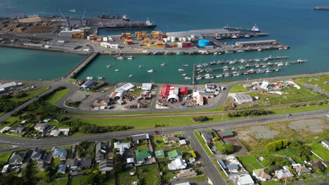 aerial view of industrial port in bluff with many ships docked at day time