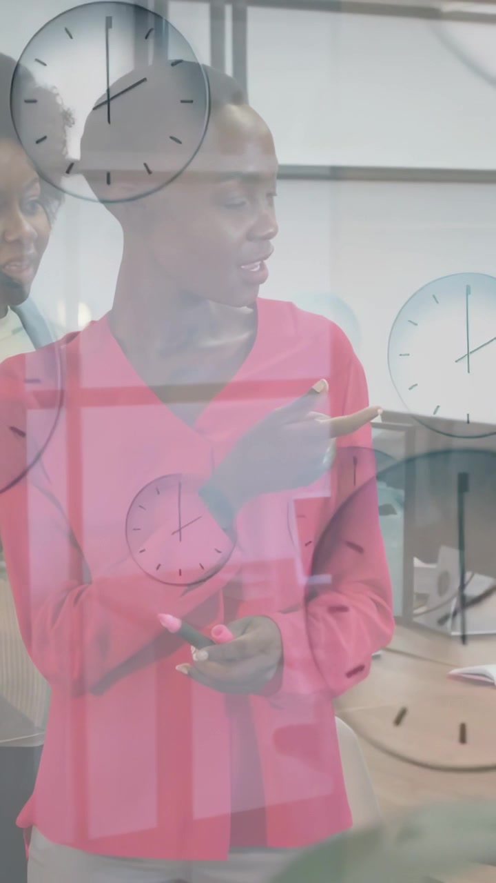Vertical video: Woman holding pen pointing at glass, causing clock overlay for business scheduling
