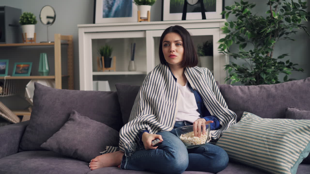 Woman Watching Movie on Couch