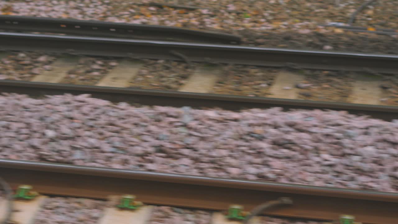 Fast Moving Iron Rail Tracks. POV on British Public Train Transportation