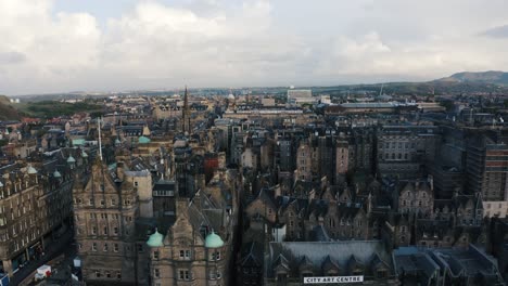 establishing aerial view of edinburgh's old gothic architecture sprawling throughout the downtown area