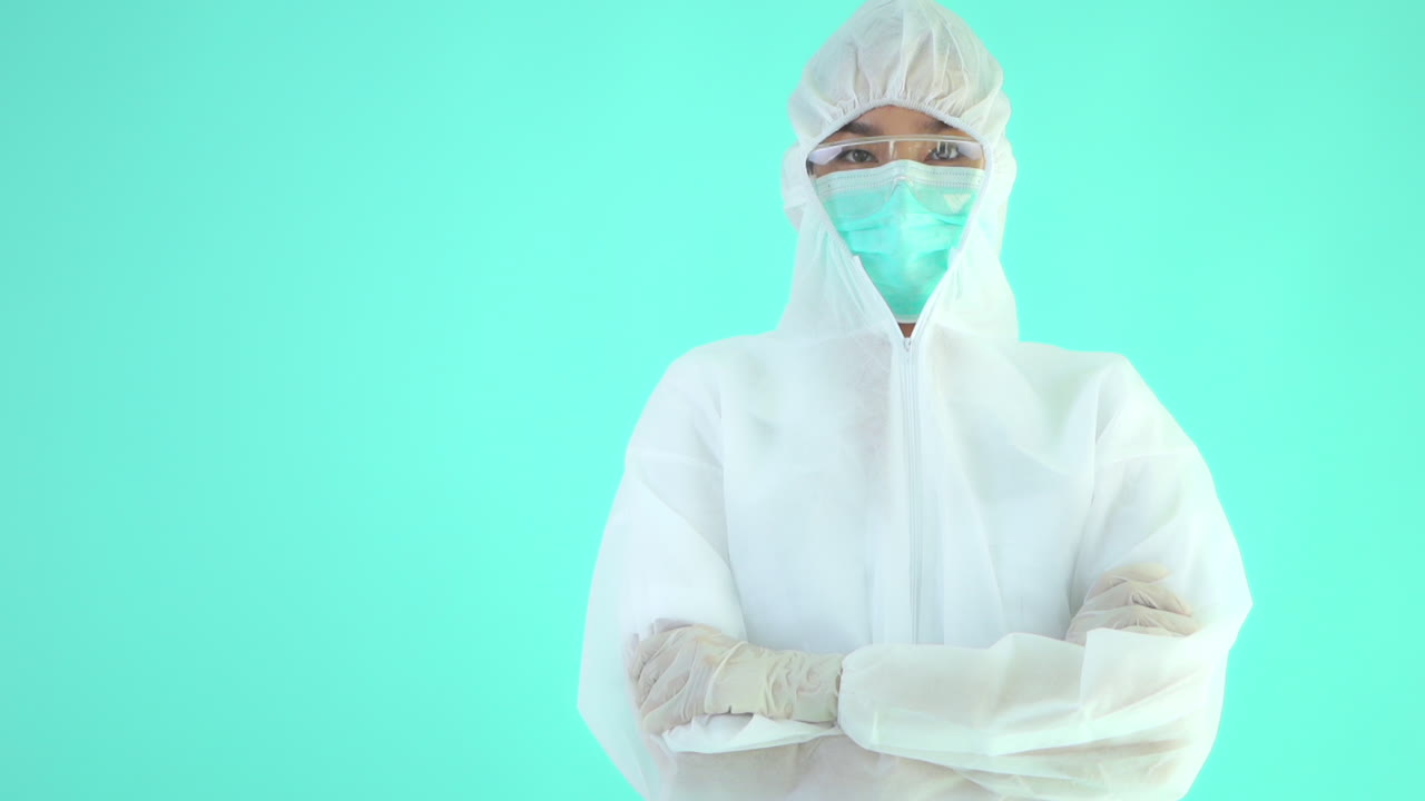 Isolated Healthcare Worker in Protection Suit Crossing Arms Copy Space