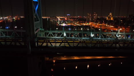 side profile shot of suspension bridge at night