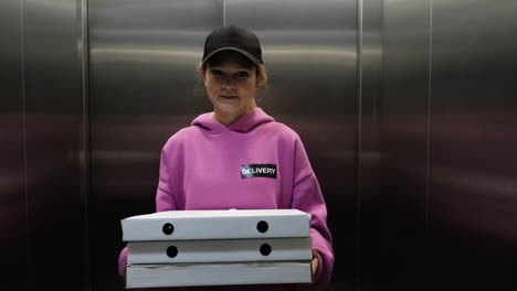 delivery woman holding carton boxes