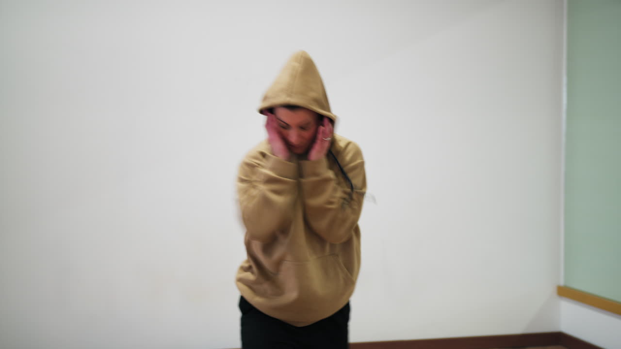 Expressive Woman Rap Dance With Hoodie And Sweatshirt In Ballroom