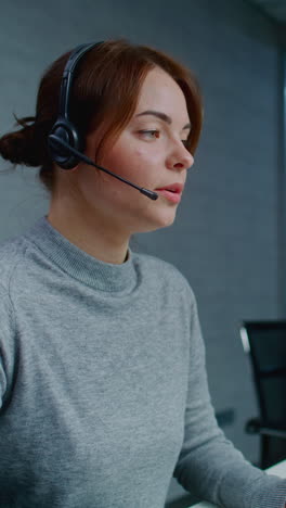 woman wearing headset in office