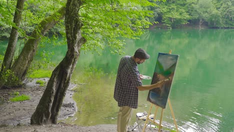Painter-painting-in-the-forest.