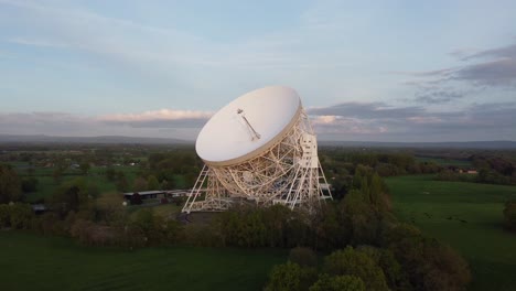 Drone-footage-flying-near-Jodrell-Bank-radio-telescope,-Cheshire,-UK