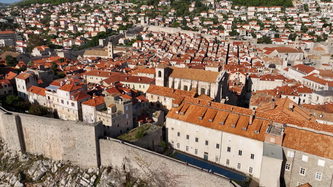 Dubrovnik old town with its red rooftops and iconic medieval walls, aerial view