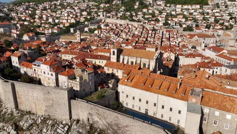 Dubrovnik old town with its red rooftops and iconic medieval walls, aerial view