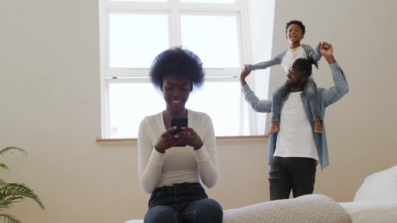 Millennial couple and son at home