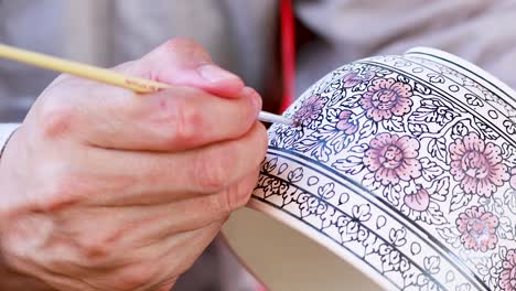 detailed hand-painting of a decorative bowl