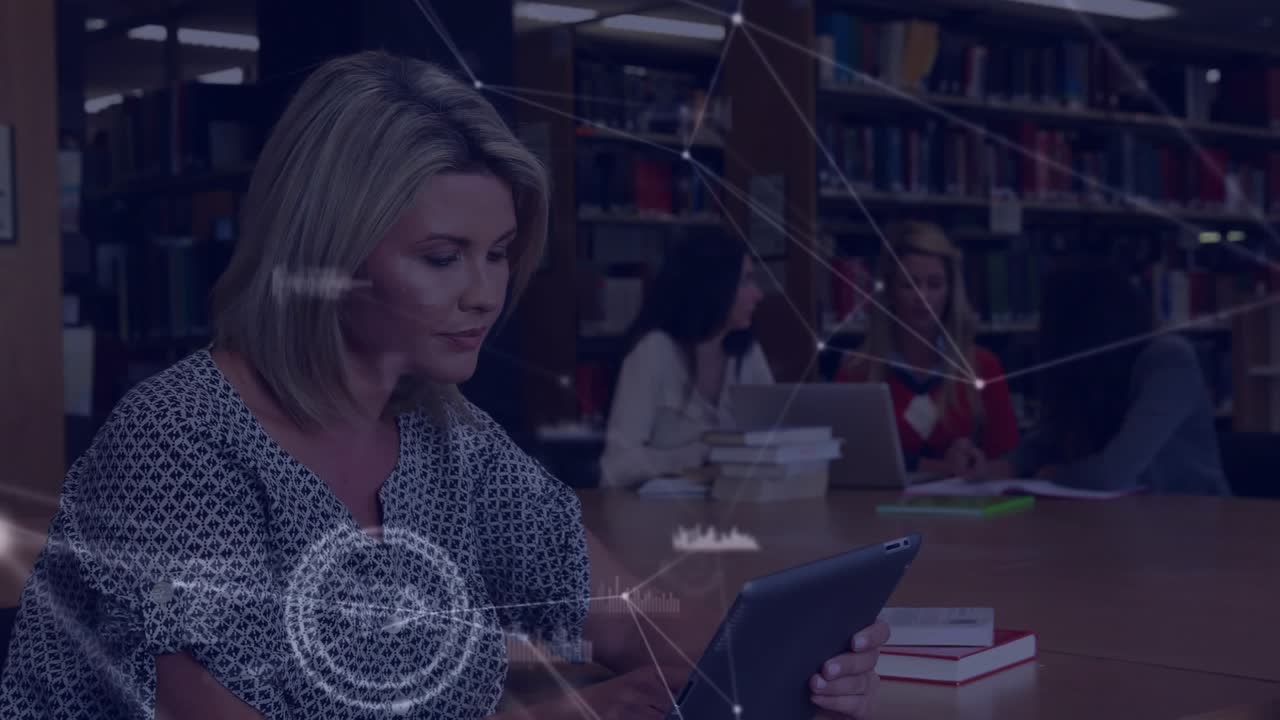 Animation of network of connections over businesswomen using laptop in office