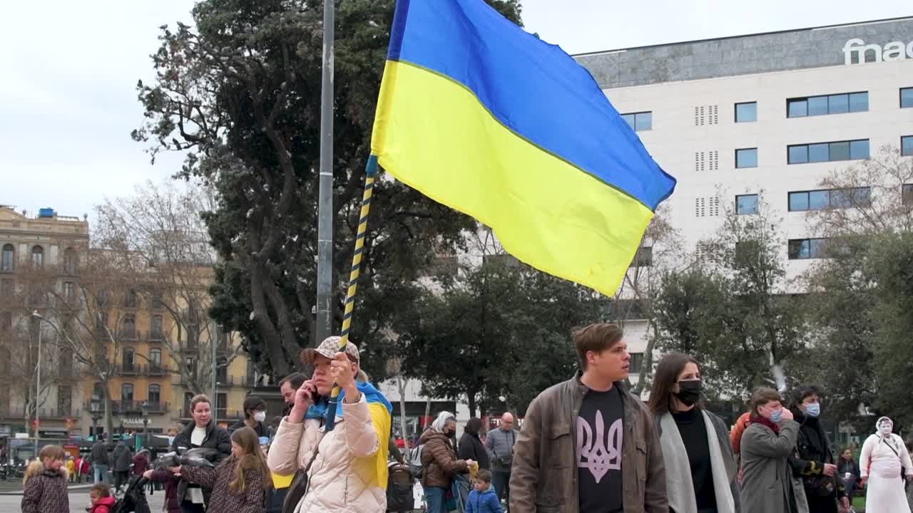 Ukrainian girl with the flag of her country as a sign of protest against Russian aggression. Not to the war. Stop Putin.