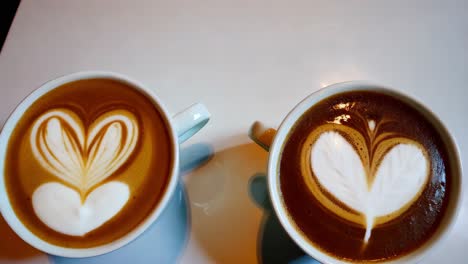 two latte art heart designs