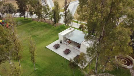 Aerial-cinematic-shot-of-a-luxury-clubhouse-with-an-outdoor-seating-area