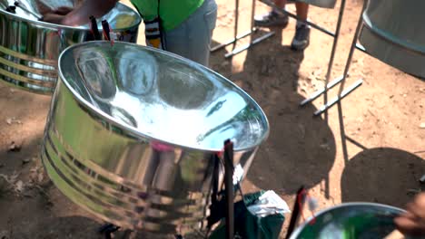 closeup of steelband drumming