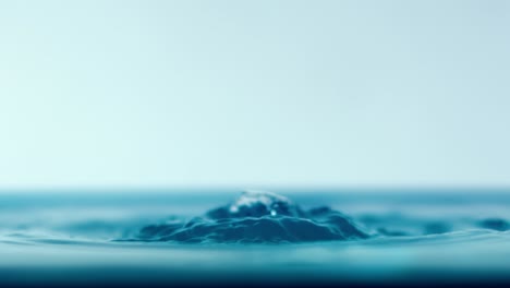 Drop-close-up-of-water-falls-in-a-super-slow-motion.