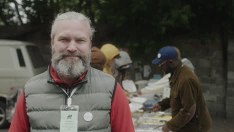 man volunteering at a food distribution event