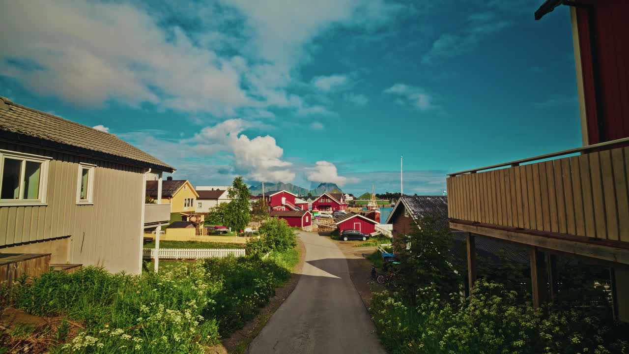 Walking around the famous red fishermen cabins in the Lofoten islands, Norway. View of local town of Svolvaer.