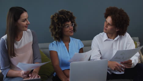 Diverse-business-colleagues-in-discussion-at-a-casual-meeting-in-the-office