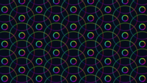 Symmetrical-pattern-of-overlapping-circles-on-black-background