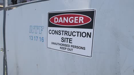 danger sign on construction site fence