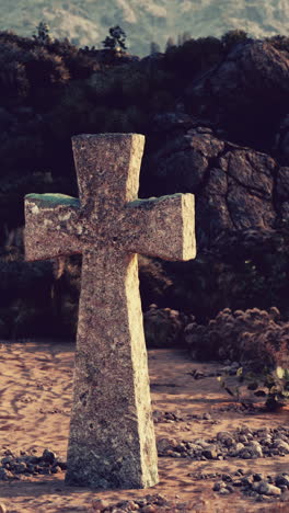 a stone cross stands in a desert landscape