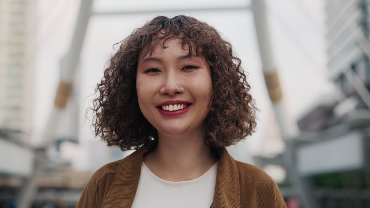 Happy Young Woman in Urban Setting