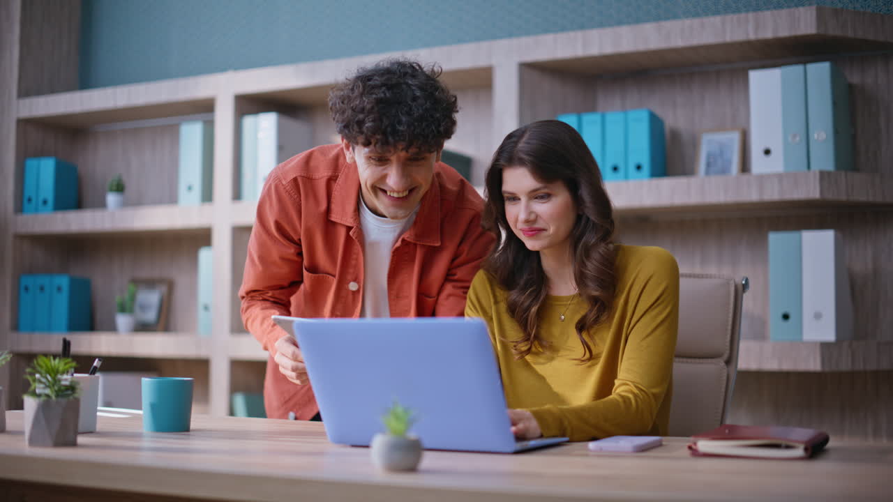 Successful coworkers collaborating project using laptop and tablet closeup