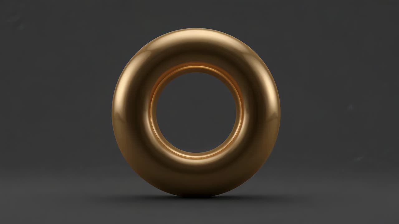 Rotating gold torus showcasing shiny finish on studio platform, camera zoom shifting highlights