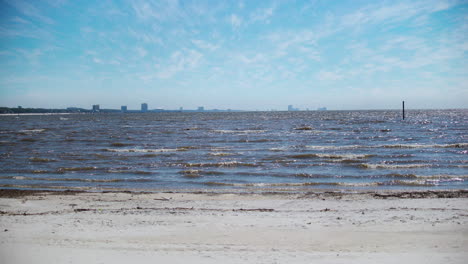 the beach in gulfport, mississippi overlooking biloxi on a beautiful sunny day