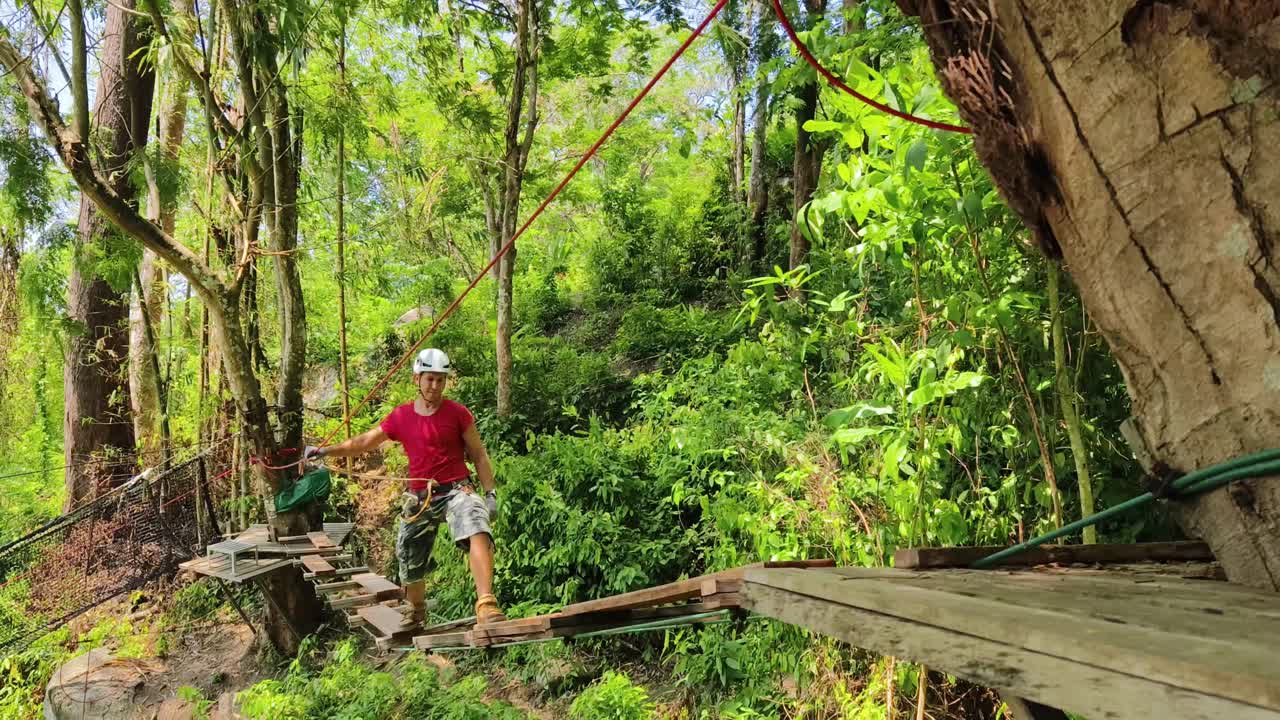 Man enjoying a forest adventure course