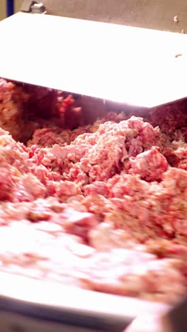 meat grinding machine in action