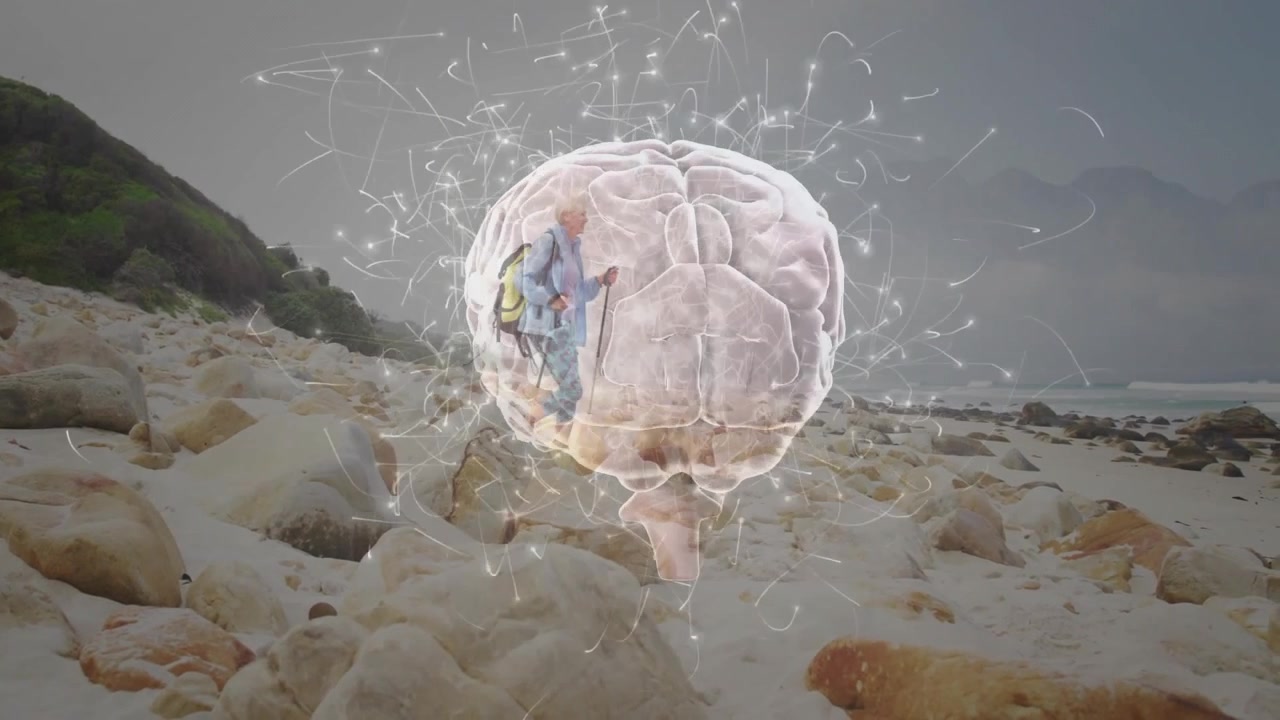 Senior Hiker Walking on Beach with Digital Brain Overlay