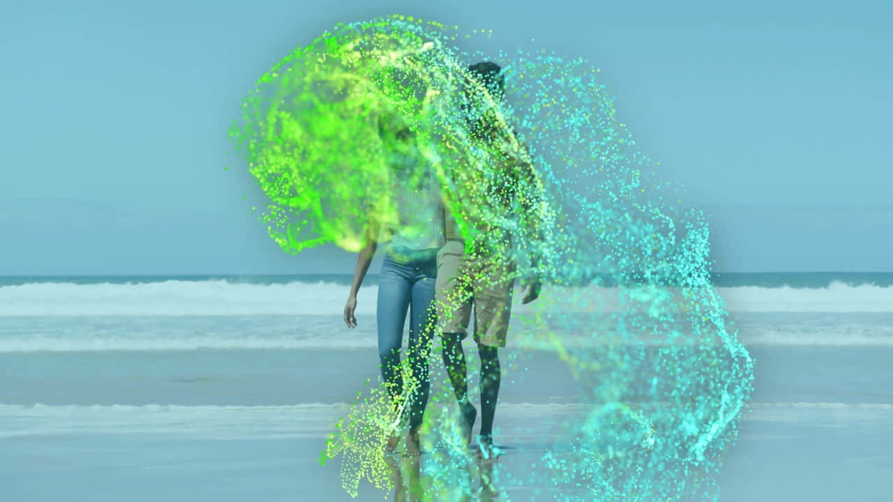 woman and man walking arm-in-arm along shoreline in tech scene, with swirling digital particles