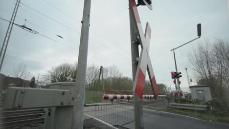 german railway crossing with train approaching
