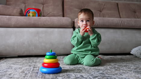 baby playing with ring stack
